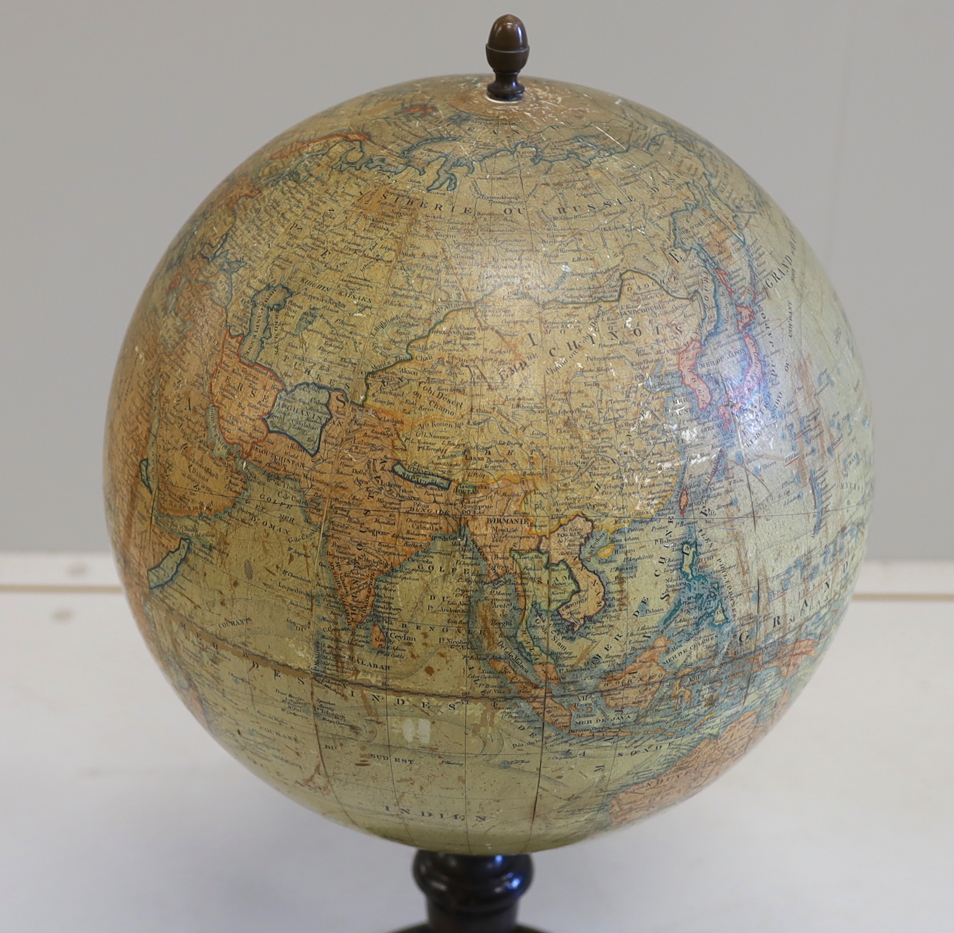 A 19th century 12 inch French globe, ‘Globe Terrestre’ published by J. Lebegue & Cie., Paris, on ebonised pine stand with inset compass, 53cm high on stand